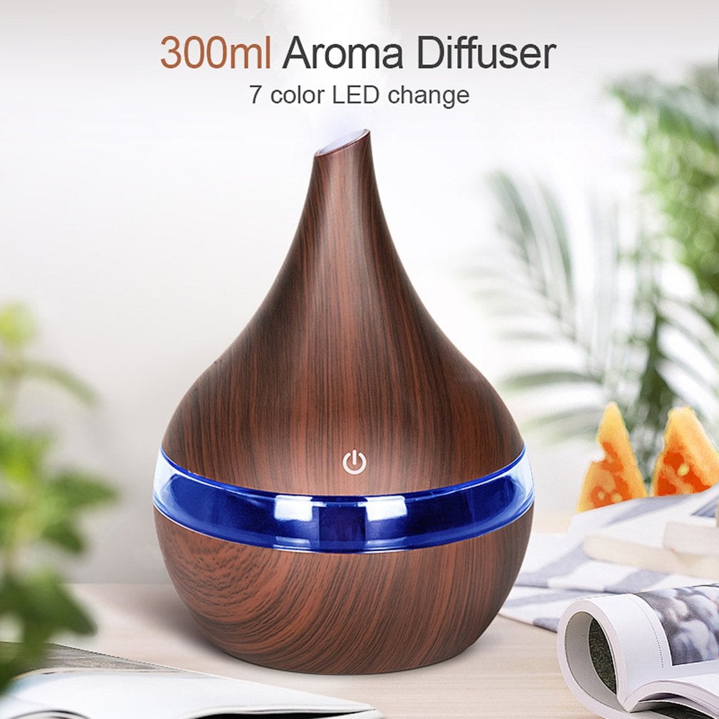 300ml USB aroma diffuser with wood grain finish and 7-color LED light, perfect for improving air quality and adding fragrance.